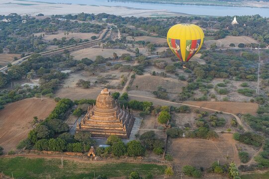 Hot air balloon at sunrise over a temple, Bagan, Myanmar