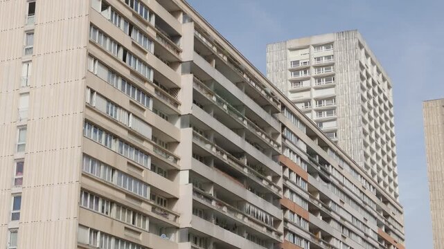 Olympiades residential towers rising against a clear sky, symbolizing urban living and modern architecture