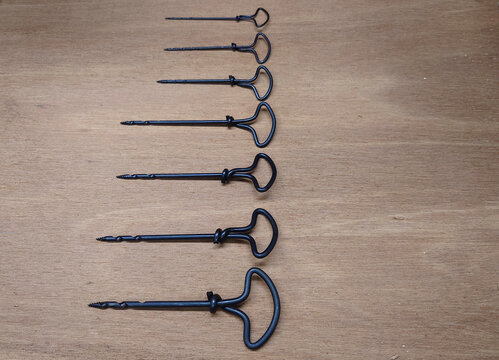 seven different size twist gimlets for boring pilot holes in wood by hand