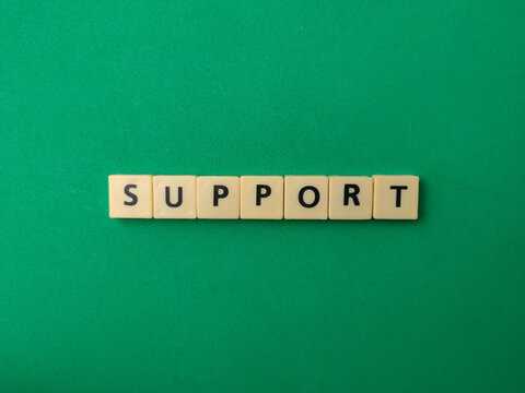 Letter tiles arranged horizontally spell the word SUPPORT in the center of a vibrant green background