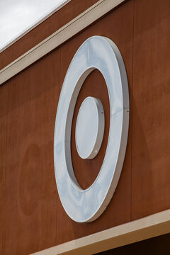 Exterior wall of retail building displaying iconic Target symbol as part of standard corporate architectural design