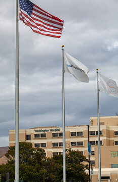 Fremont California Washington Hospital exterior showing prominent signage and flagpoles with national and institutional flags