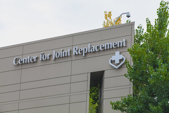 Fremont California Center for Joint Replacement building facade featuring cross‑and‑heart emblem identifying regional orthopedic medical facility