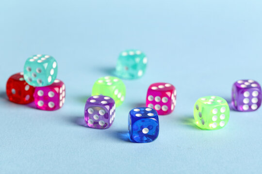 Colorful game dices on blue background