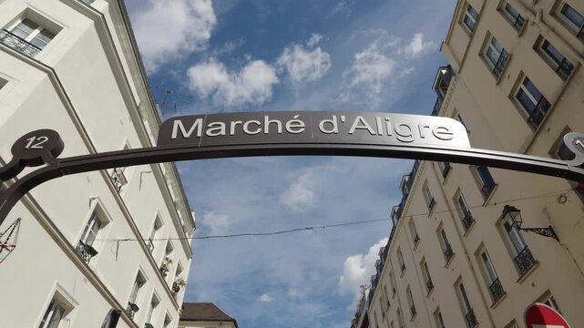 Marche d'Aligre street market sign welcoming visitors to the bustling outdoor shopping area