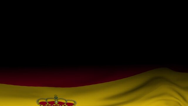 Spanish national flag ripples gently under dramatic lighting against an empty black background.