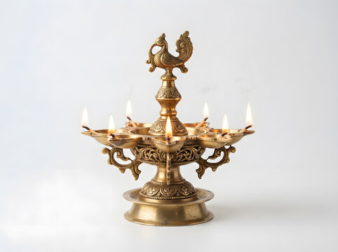 Traditional brass diya lamp with burning flames for Diwali festival and religious worship