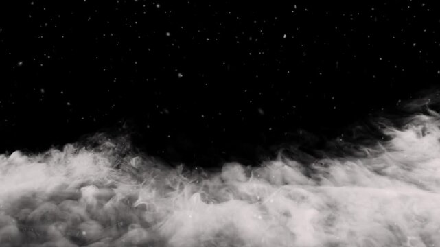 White fog rolls across the lower frame beneath a dark starry background.