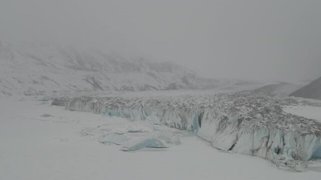 Aerial view of Laigu Glacier with blue ice walls in Tibet