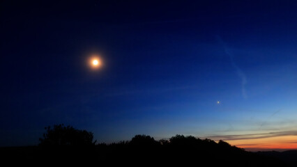 Moon, planet conjunction and landscape scenery silhouettes. © astrosystem