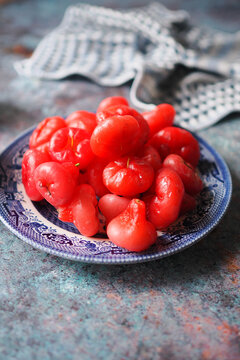 Pile Of Red Wax Apples On Blue Ceramic Plate, Tropical Fruit Close-Up