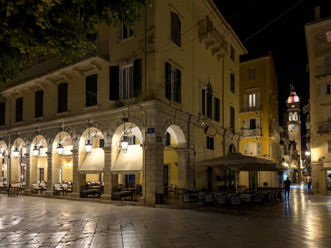 Night view of Liston arcade and Saint Spyridon Church bell tower in Corfu Town, Greece