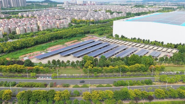 Wide aerial view of solar parking and surrounding urban housing
