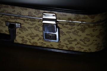 Vintage Cartoon-Themed Suitcase with Metal Lock and Patterned Leather Finish © alexkich