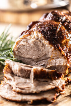 Detailed macro shot of juicy roasted pork shoulder with a perfectly browned crust. 