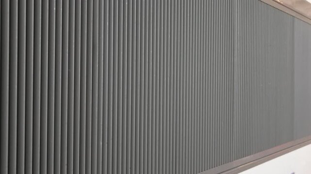 Close-up of the ribbed metal side panel of a train carriage, Cannes, France