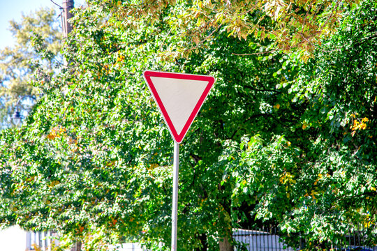 Yield traffic sign on pole outdoors