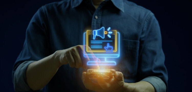 Businessman finger touching smartphone displaying glowing computer monitor and megaphone icon. Online advertising campaign, digital public relations marketing, and media broadcast concept.