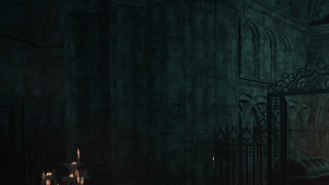 A stone structure stands in the dark. Flickering candles are placed on a stone table nearby. The area is enclosed by a wrought iron gate. Shadows fall across the ancient walls.