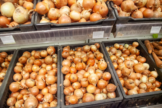 Fresh onions are sold in the store