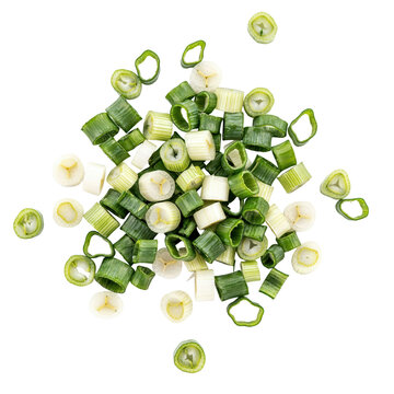 A pile of freshly chopped green onion scallion rings on a white surface isolated on a transparent background