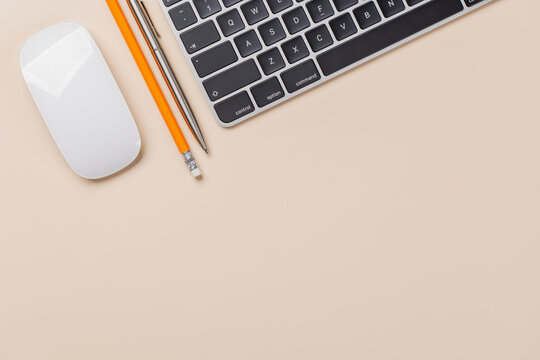 Office supplies on beige desk