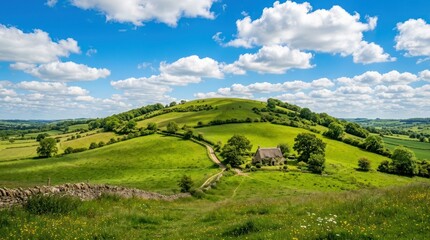 Obraz premium Idyllic English Countryside Landscape With Rolling Green Hills And A Quaint Cottage