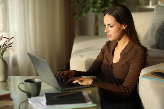 Telecommuter using laptop working at home