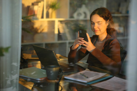 Telecommuter using smart phone working at home