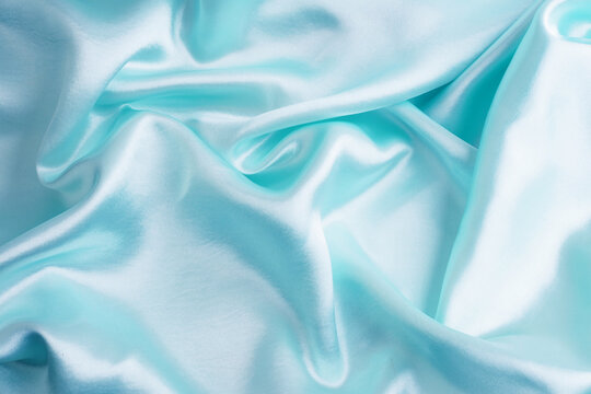 Smooth elegant blue satin silk fabric texture abstract background