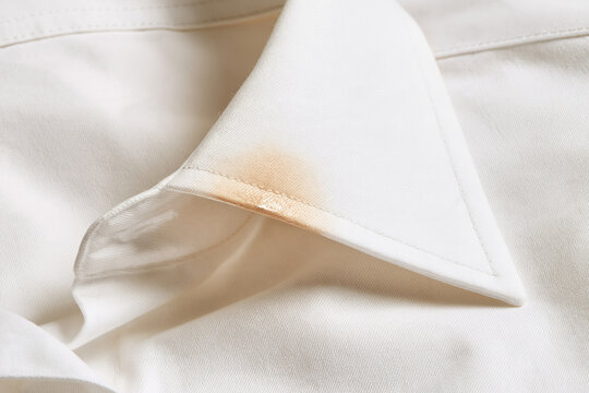 White shirt collar with a visible rust stain close-up  