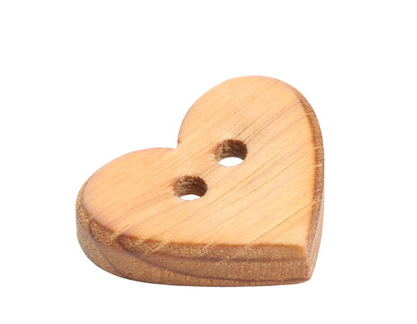 Natural wooden heart shaped button with two holes isolated on a transparent background a charming craft element for DIY projects fashion and decorative designs beautiful sewing perfect
