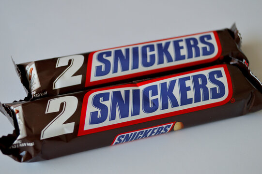 Two Snickers chocolate candy bar twin packs with bold red and blue branded packaging displayed on a clean white background