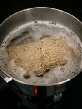 Noodles Boiling In Pot On Stove