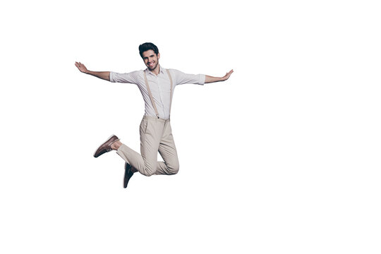 Full length photo of cheerful attractive guy jump have date with lovely girl fooling imagine he fly plane wear modern clothing isolated over grey color background