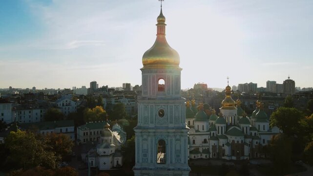 Drone forward approach toward ornate bell tower facade in Kyiv, Ukraine