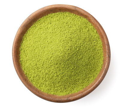 A small pile of matcha powder in the wooden plate, isolated on white background, top view.