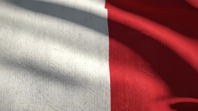 Waving flag of Malta, a European island nation, with white and red colors and rippling fabric texture.