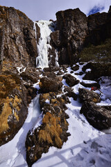 Frozen Waterfall in Rocky Winter Mountain Landscape © TuongDuc