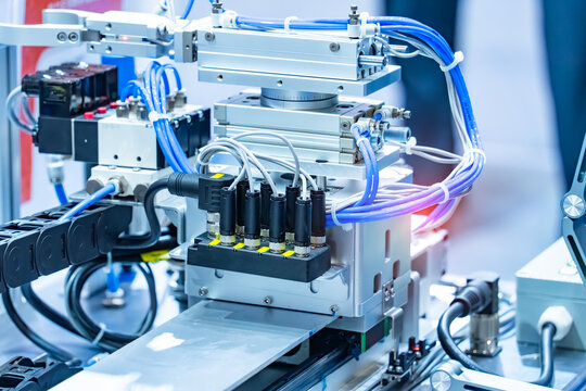 pneumatic hose fittings that connect to air hoses are installed on pneumatic equipment on a production line