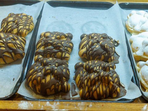 Pan de Muerto Breads with Chocolate Topping in a Market Bakery