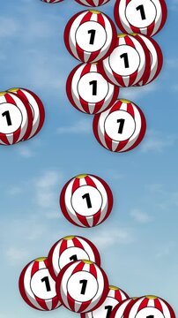 Vertical Animation of Red and White Striped Numbered Spheres Falling Against Blue Sky