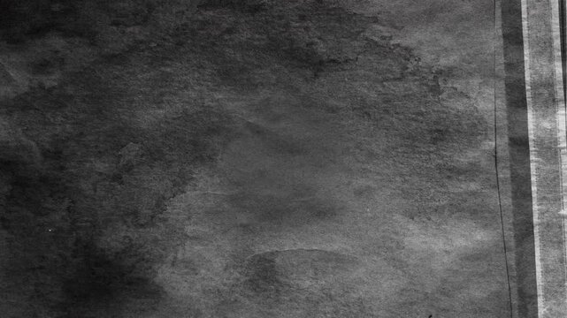 Abstract dark textured background with subtle vintage grain effect.