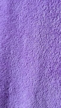 close up texture of purple cotton towel fabric background