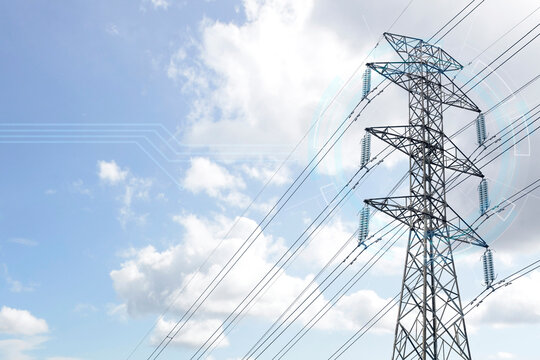 Smart grid technology concept featuring a high-voltage power transmission tower with a futuristic digital HUD graphic overlay against a blue cloudy sky. Concept of the electricity energy industry
