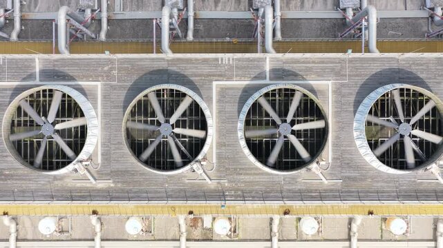 Lateral top down view of rooftop cooling fans and pipework