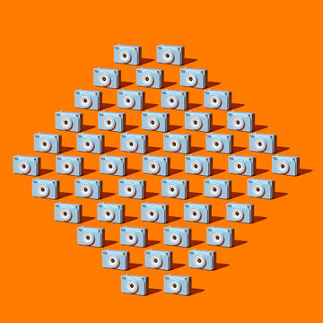 A diamond pattern displays a blue camera on an orange background