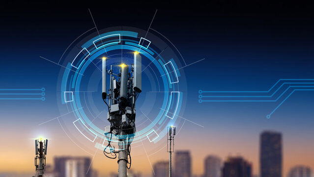 Telecommunication tower with futuristic HUD graphics and digital connections over blurred city at sunset, representing 5G network technology. Concept of communication network and connection technology