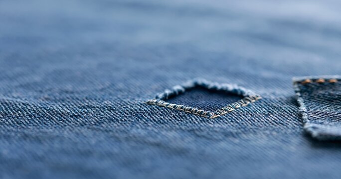 Close-up of denim fabric with patch