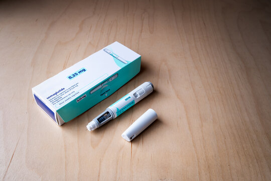 Semaglutide 0.25mg Pre-Filled Injection Pen and Packaging Box on Wooden Desk
